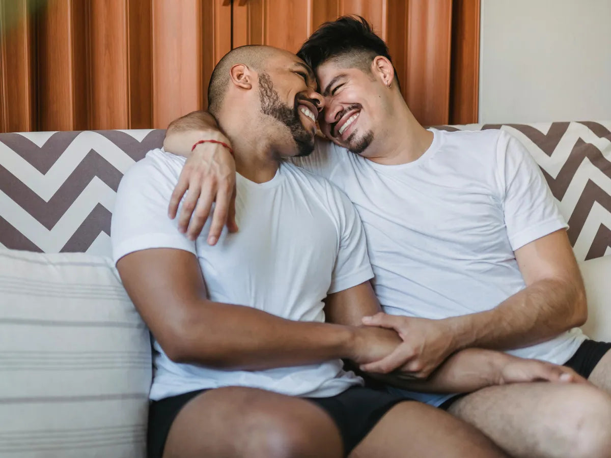two people taking a sexual orientation test together on a couch